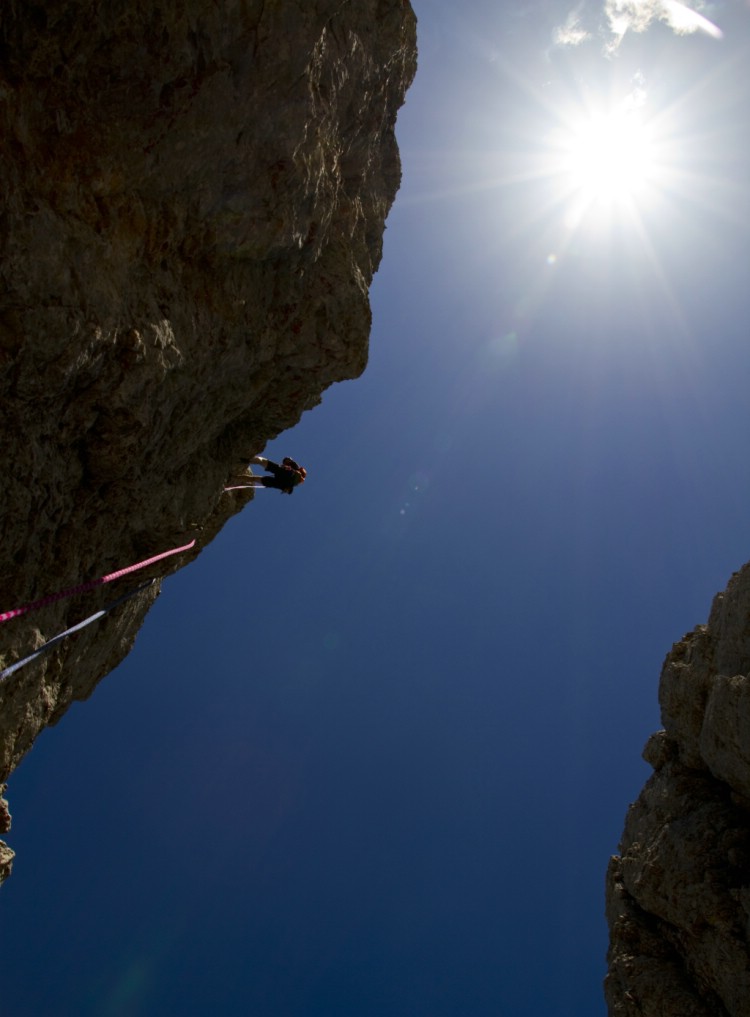 Gustav Forssell rappelling down from Delago turn.     July 9 2010 Photo: Andreas Bengtsson